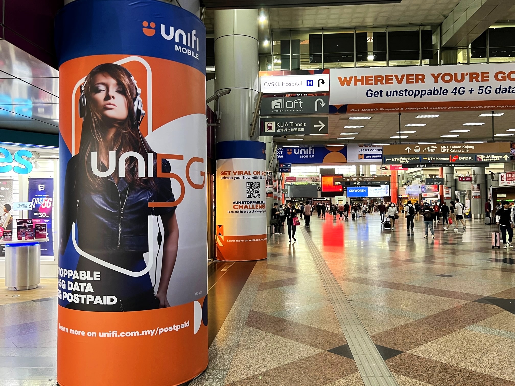 KL Sentral pillar graphics with vertical lightbox advertising