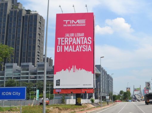Free-standing uni-pole billboard beside a Malaysian highway